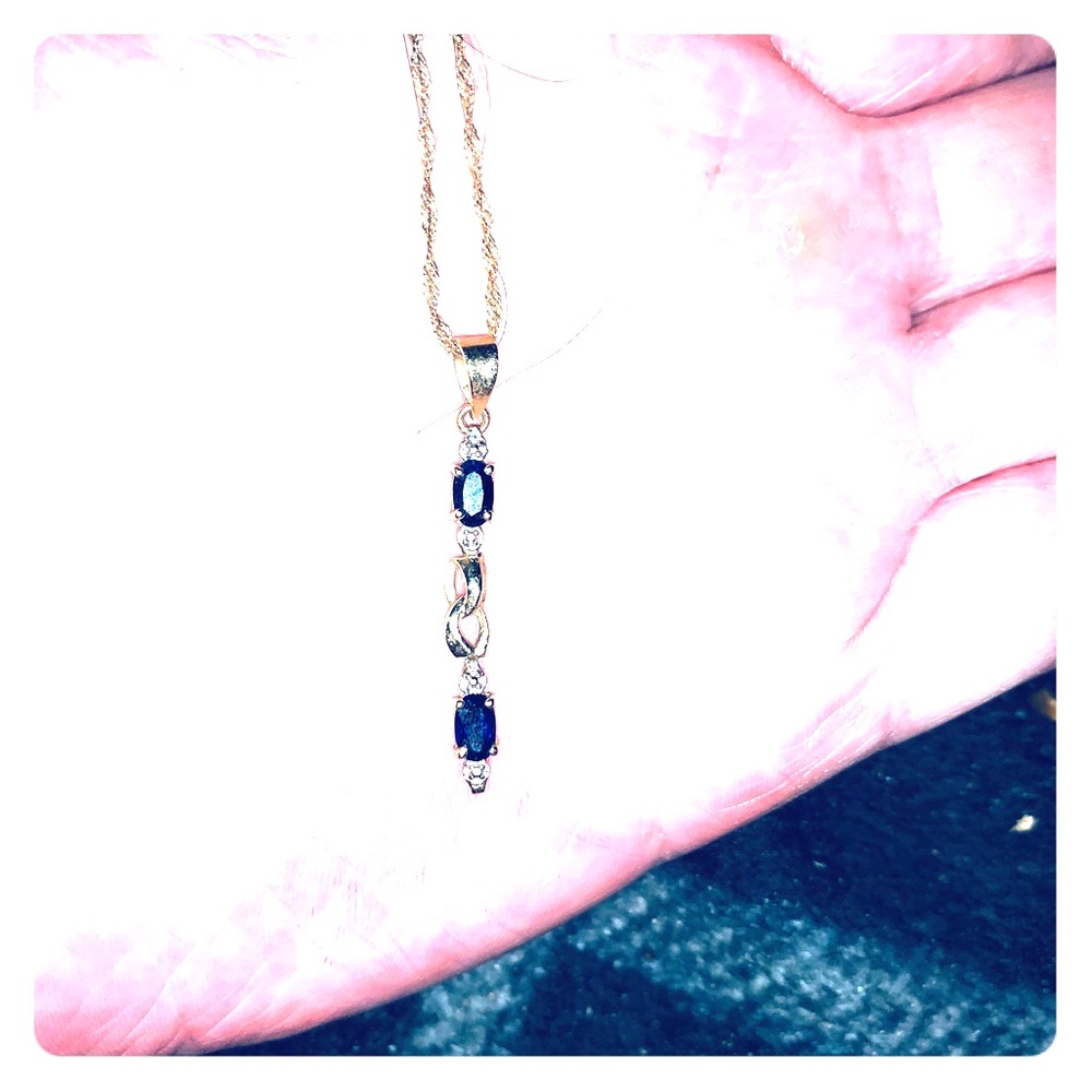A gold sapphire and diamond necklace